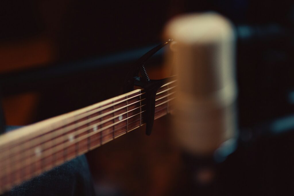 Capo on the neck of an acoustic guitar