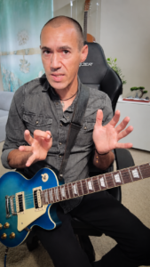 Michael Edwards teaching guitar during an online lesson